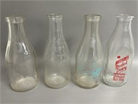 Four Vintage Milk Bottles