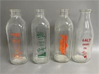 Four Vintage Milk Bottles