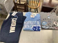 UNC shirts and a pair of sweatpants
