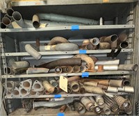 5 shelves of exhaust parts