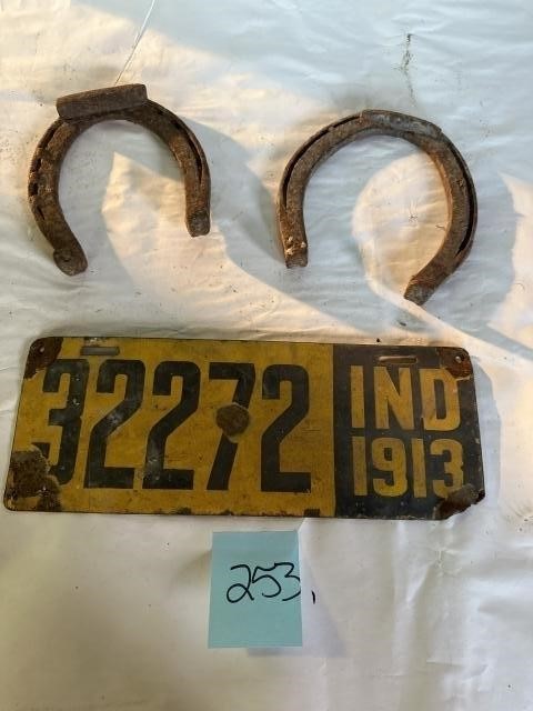 Old license plate and two horseshoes