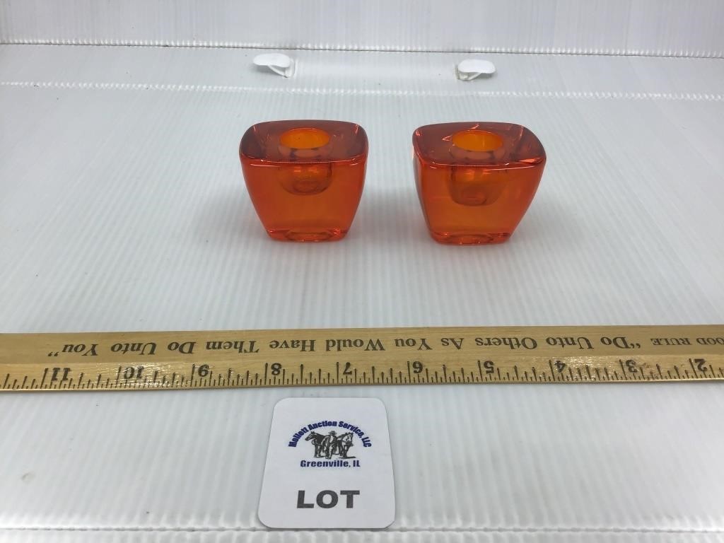PAIR OF ORANGE ART GLASS CANDLE HOLDERS