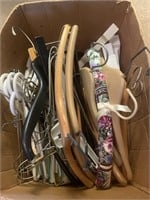 Assorted  hangers - wood, plastic, cloth