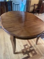 Wooden legged table with leaf