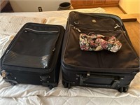 Two suitcases in a little make up bag