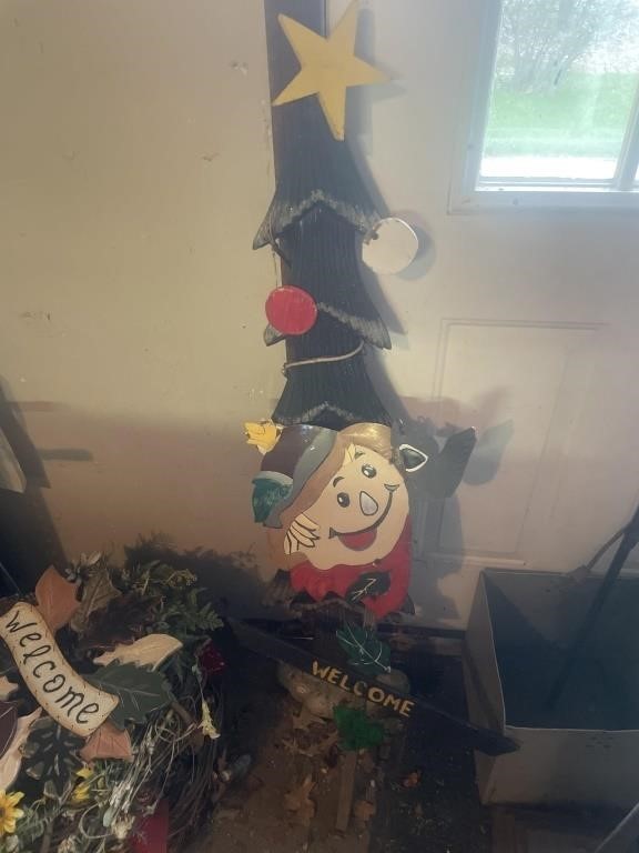 Wooden Christmas tree, and metals scarecrow sign