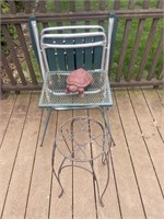 Lawn chair, two metal stands, and a turtle