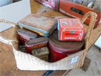 basket of tobacco tins