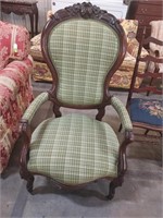 Carved Victorian parlor chair, green plaid fabric
