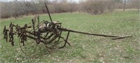 John Deere primitive steel wheel cultivator.