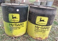 (2) John Deere 5-gallon cans.