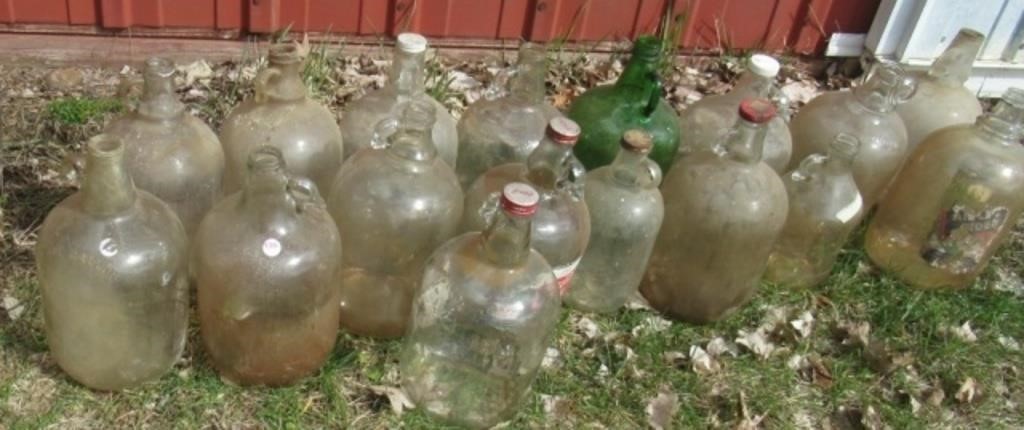 (17) Assorted glass jugs.