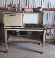 Puritan kerosene stove with extra parts.