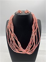 Signed Sterling and coral colored necklace