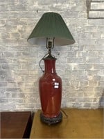 Red lamp on wooden base