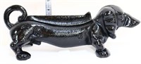 Black cast iron weenie dog boot scraper