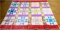 Vintage hand stitched quilt w/ red border, see pic