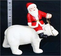 Cast iron Santa on polar bear bank