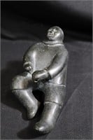 Inuit soapstone carving man pulling rope