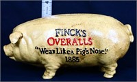 Cast iron Fincks Overalls pig bank