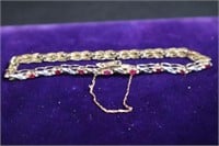 10K gold ruby & diamond tennis bracelet