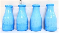 Lot of 4 blue milk glass milk bottles