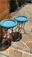 A set of teal round outdoor tables