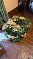 2 Christmas wreaths and a hanging storage