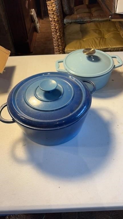 2 blue cast iron pots