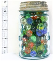 Vintage glass fruit jar w/ marbles inside