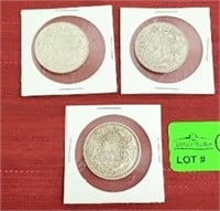 (3) 1951 and 1958 Canadian 50 cent coins.