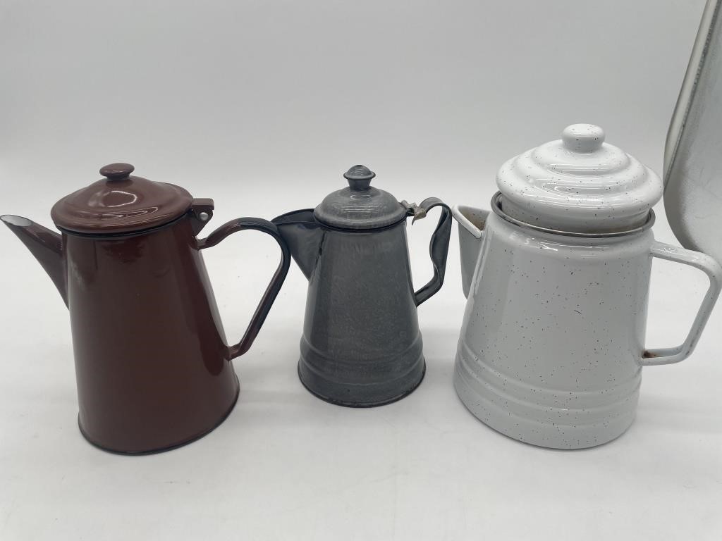 Three Enamel Pitchers