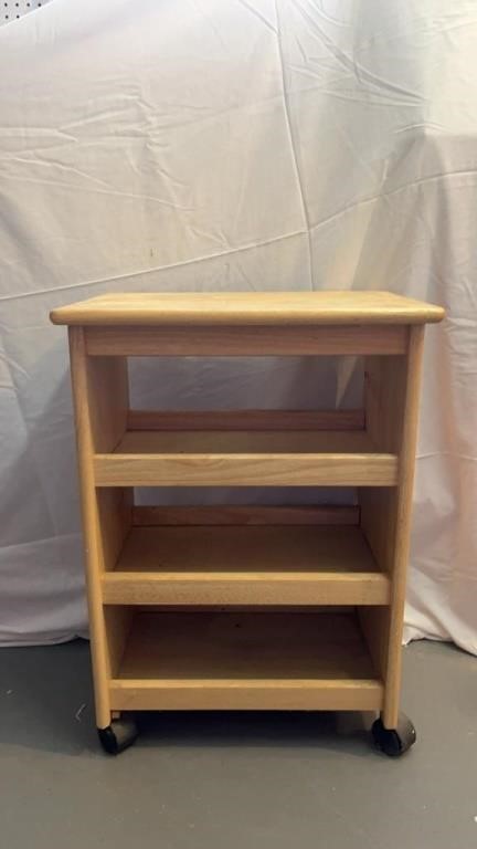 A WOODEN ORGANIZER STAND ON CASTERS