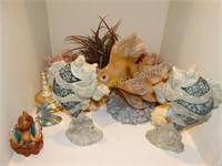 Contents of shelf, fish statues, coral, sea