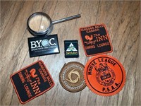 Badges and magnifying glass