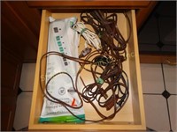 Contents of one drawer, power strip and extension