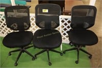 3 black office chairs