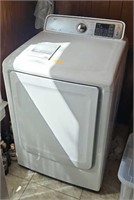 SAMSUNG ELECTRIC DRYER HAS DENT ON TOP
