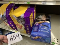 Bags of Meow Mix and Perina Cat Food