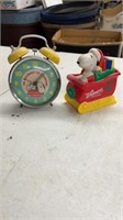 Equriy Snoopy alarm clock and coin bank.