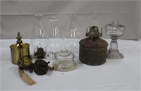 Assortment of oil lamp parts, bases, chimneys,