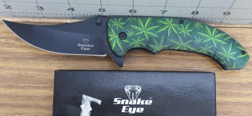 Snake eye marijuana leaf pocket knife
