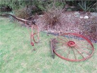Iron wheel and vintage plow