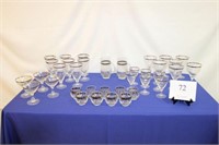 SET OF SILVER RIMMED GLASSWARE AND PITCHERS