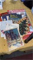 Christmas Carol song books and cookie boxes