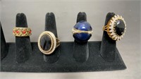 (4) gold toned rings, some has rhinestones