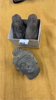 Three small rock Buddha figurines