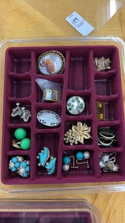 Small container of clip on earrings