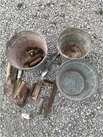 Three metal buckets and tools