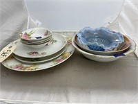 Pile of China plates, bowls and platers